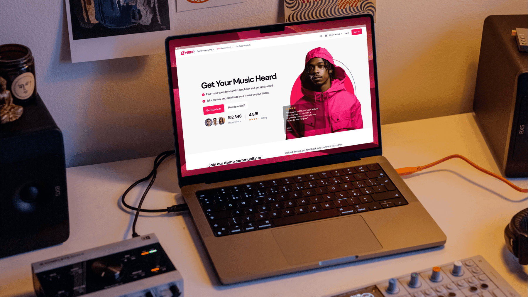 A laptop in a studio showing the VIRPP homepage: "Get your music heard", with a 4.8 out of 5 rating and the number of users.