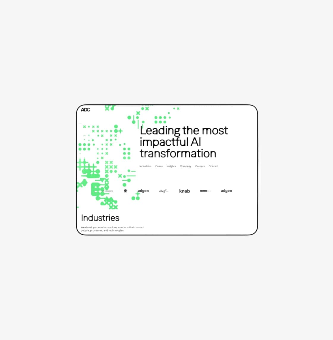 ADC's homepage on a laptop: the heading "Leading the most impactful AI transformation", a row of client logos and the start of the Industries section.