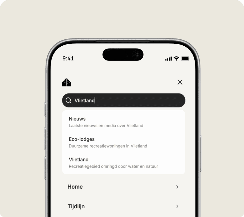 Searching on a phone: "Vlietland" in the field, with suggestions below for news, eco-lodges and the recreation area itself.