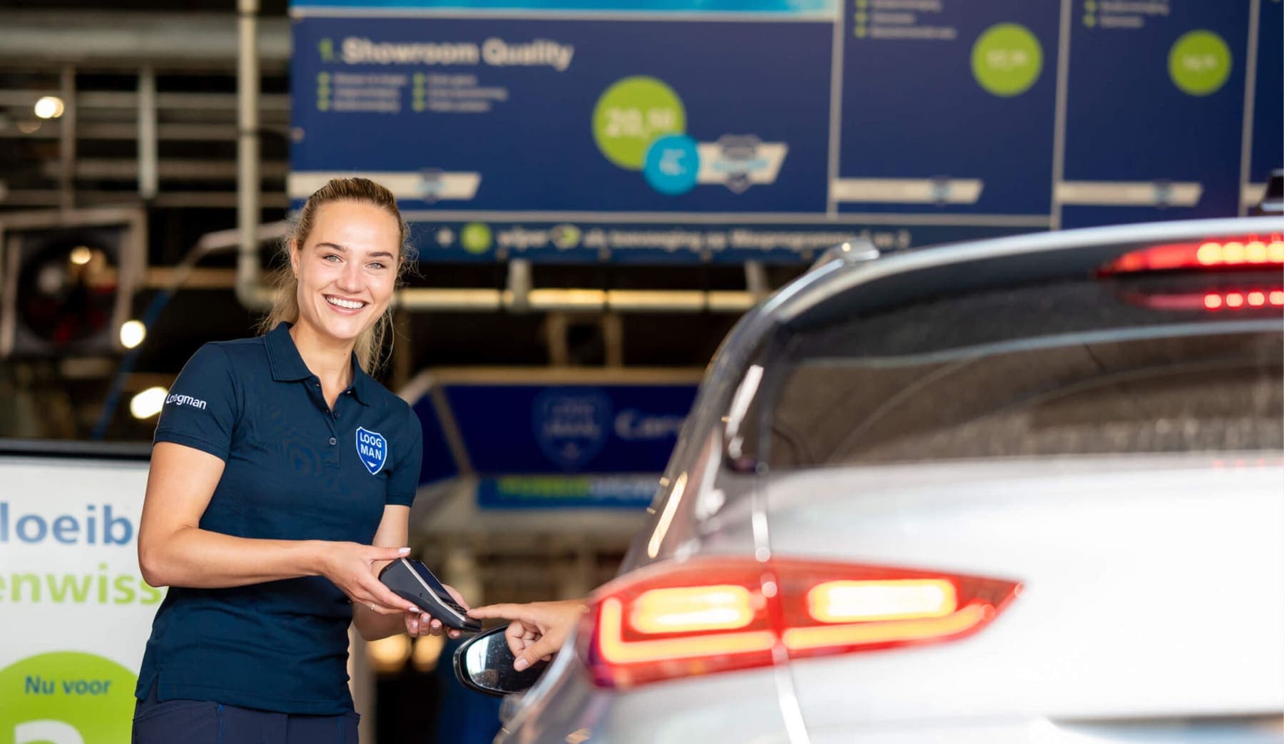 A Loogman employee at the car wash